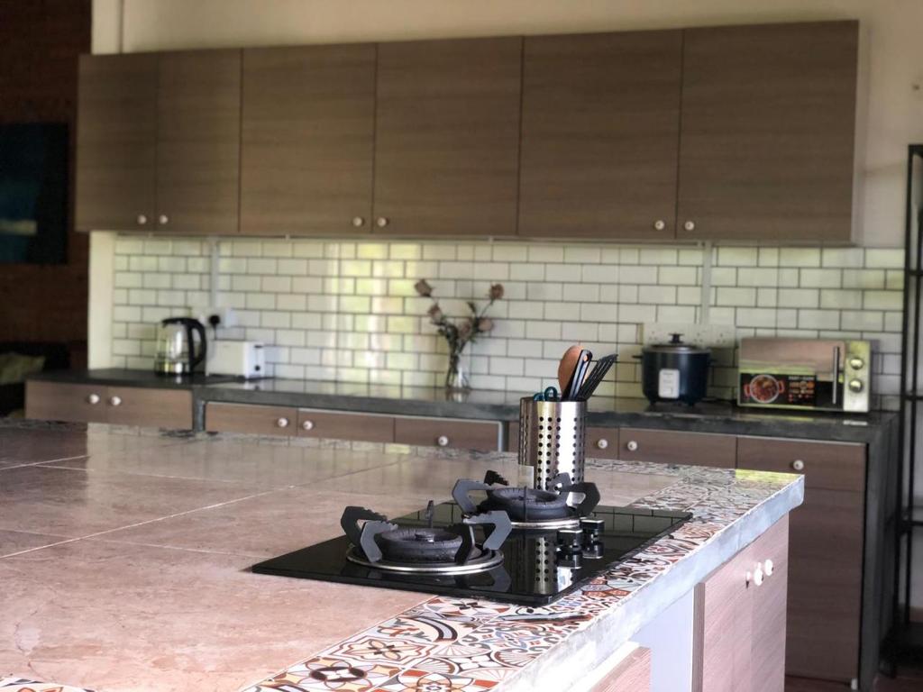 Kuchyň nebo kuchyňský kout v ubytování Pondok Keladi Langkawi Guesthouse
