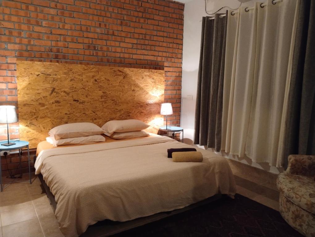 Postel nebo postele na pokoji v ubytování Pondok Keladi Langkawi Guesthouse