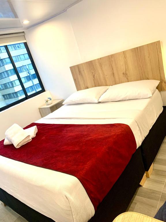 Postel nebo postele na pokoji v ubytování Hotel Urban Center Bogota