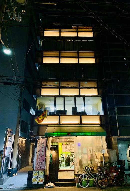 a building with bikes parked in front of it at Yiyihouse shinsaibashi in Osaka