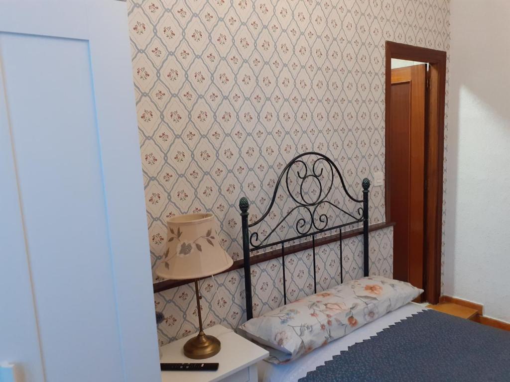 Postel nebo postele na pokoji v ubytování Uría 25 rooms