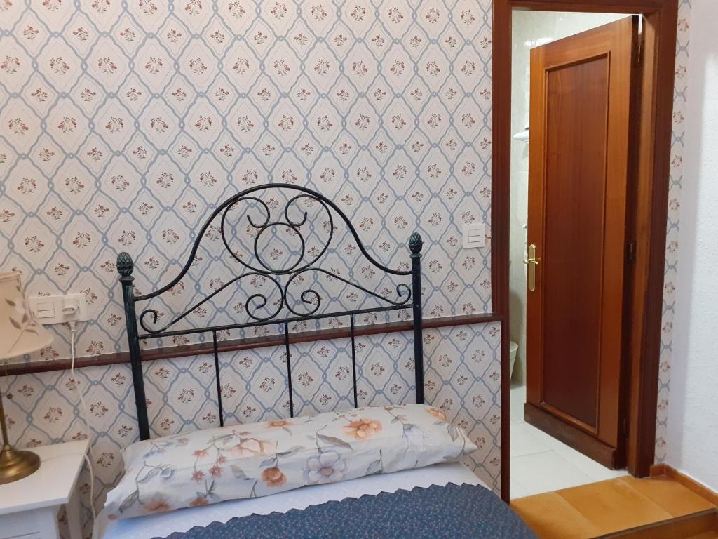 Postel nebo postele na pokoji v ubytování Uría 25 rooms