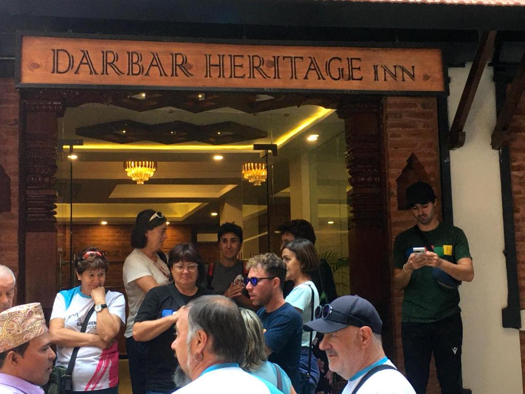 a group of people standing in front of a barrientle in at Darbar Heritage Inn in Kathmandu