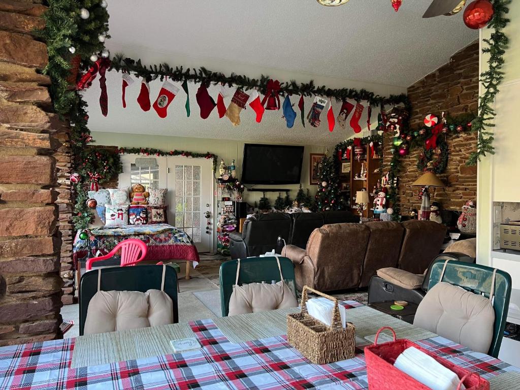 a living room with christmas decorations on the wall at Fishers Of Men Ranch Home in Marble Falls
