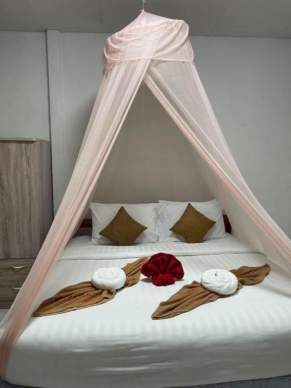 Postel nebo postele na pokoji v ubytování Happy Home Kohjum