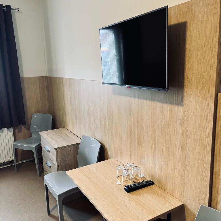 TV a/nebo společenská místnost v ubytování Hotel U námořníka