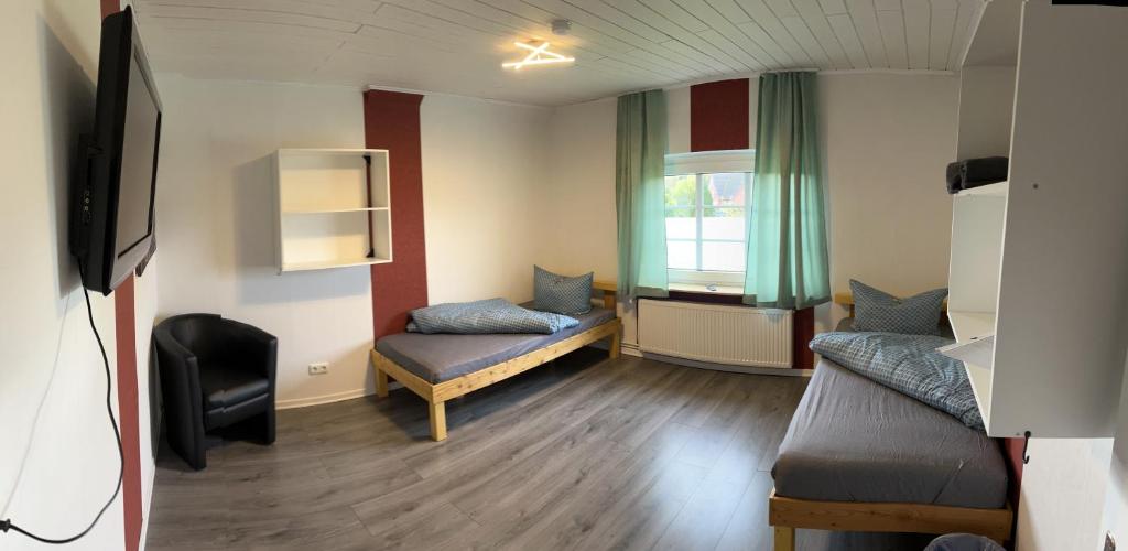 TV a/nebo společenská místnost v ubytování Zimmer 4