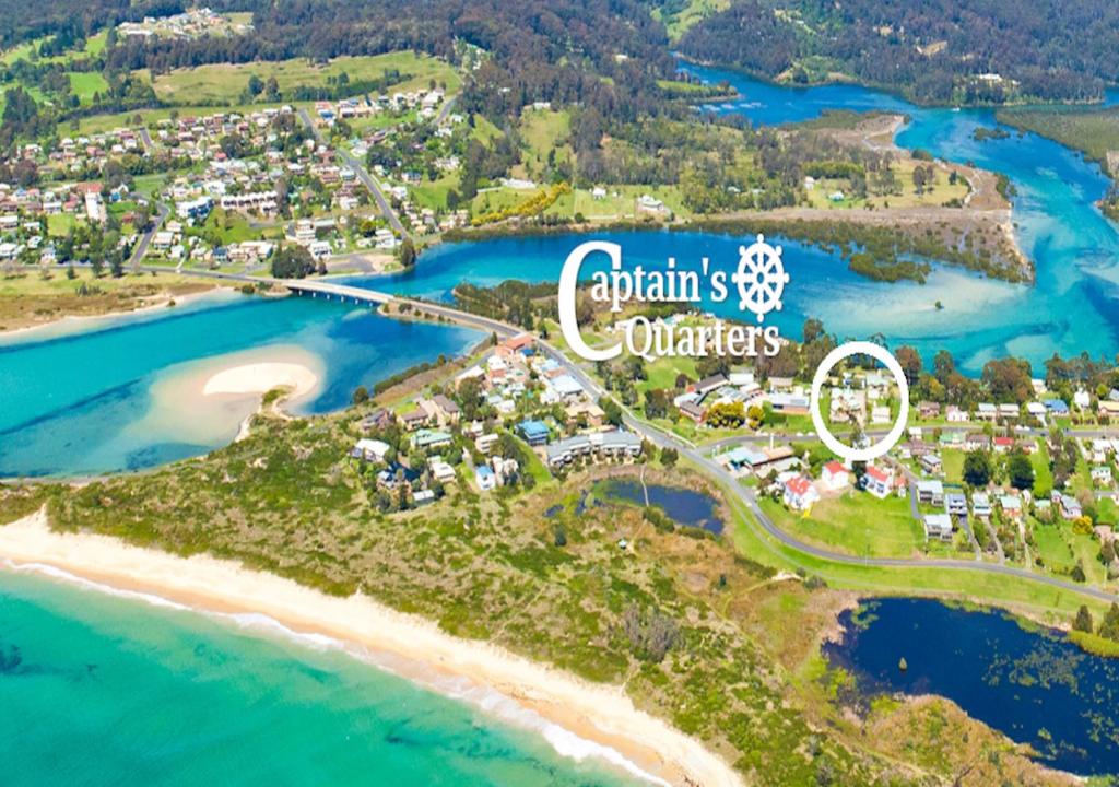 an aerial view of austins quarters on the beach at Captain's Quarters Bermagui in Bermagui