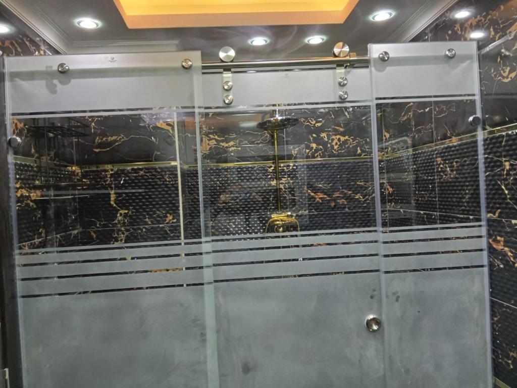 a metal door with a bunch of insects in it at wow super lux apartment near to Nile شقة سوبر لوكس جديدة جامعة الدول العربية المهندسين in Cairo