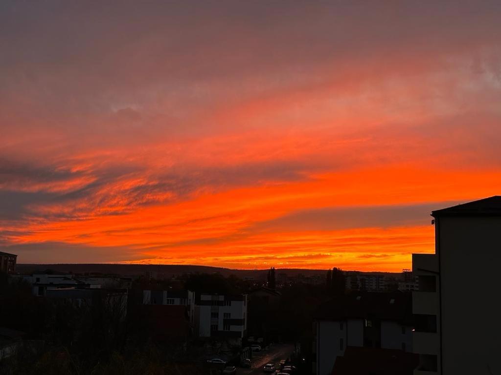 a sunset with a red and orange sky at Sunset view in Craiova