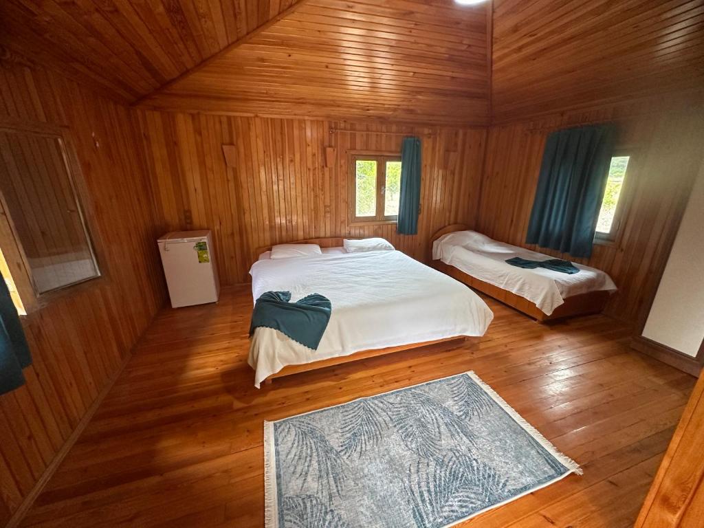 an overhead view of a bedroom with two beds at Likya Yanartaş Bungalow in Kemer