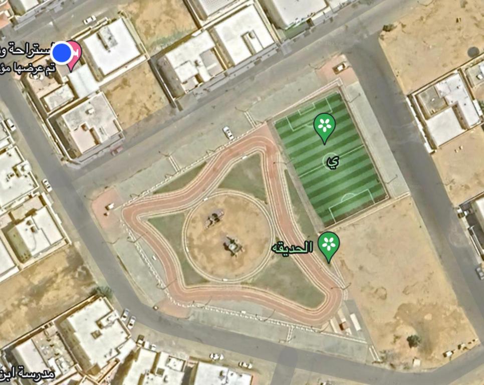 a map of a soccer field with two green markers at استراحة وشاليه عزوز in Yanbu
