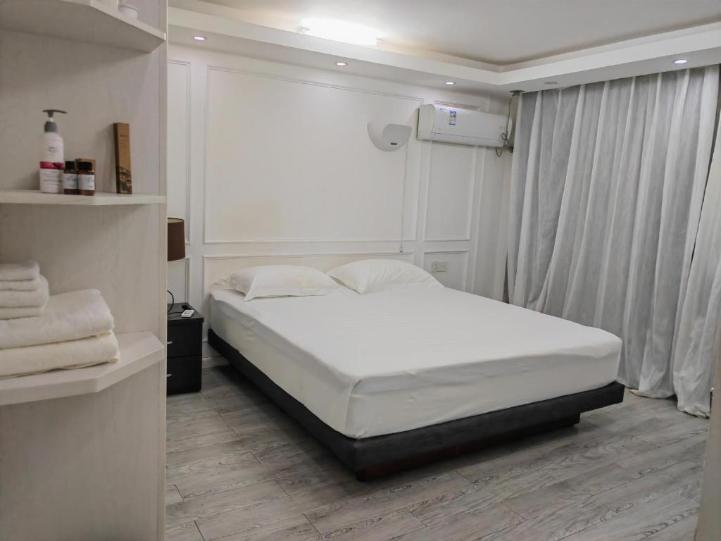 Postel nebo postele na pokoji v ubytování LATA HOTEL