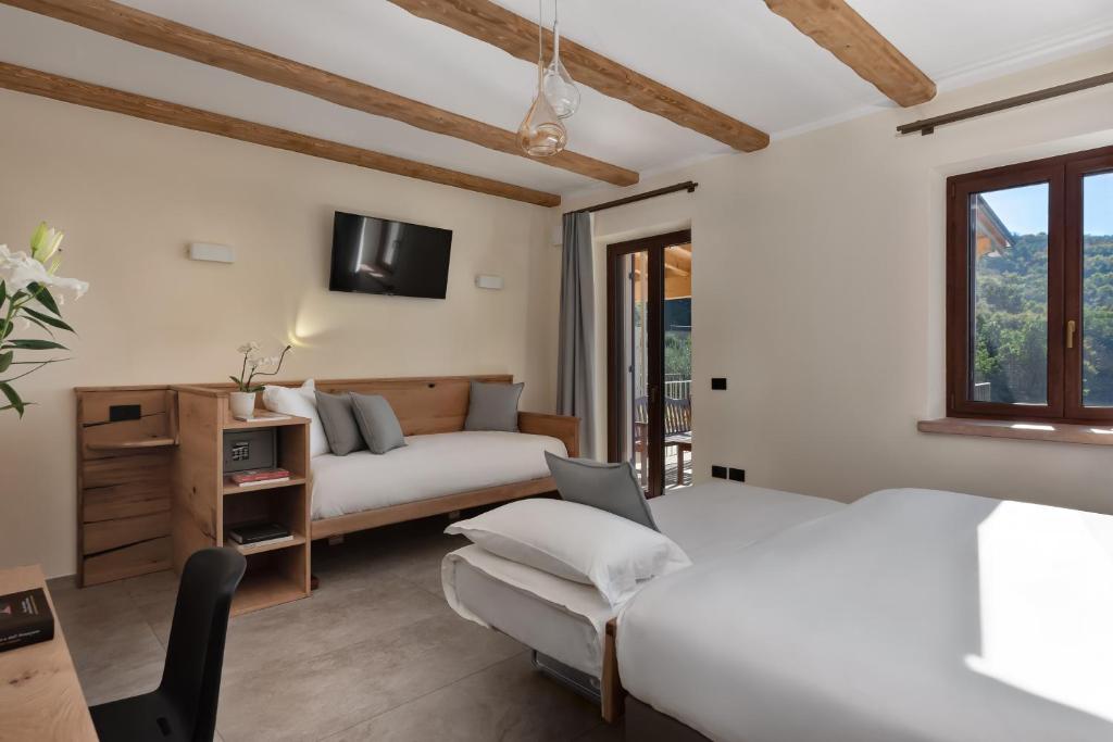 Postel nebo postele na pokoji v ubytování Sporting Hotel San Felice