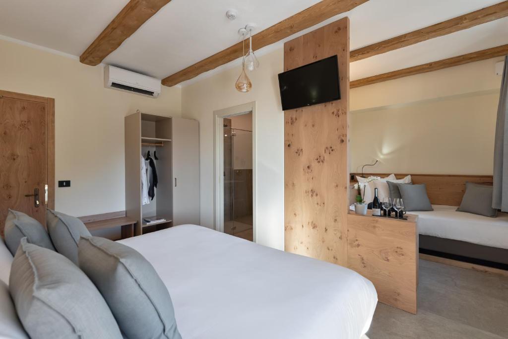 Postel nebo postele na pokoji v ubytování Sporting Hotel San Felice