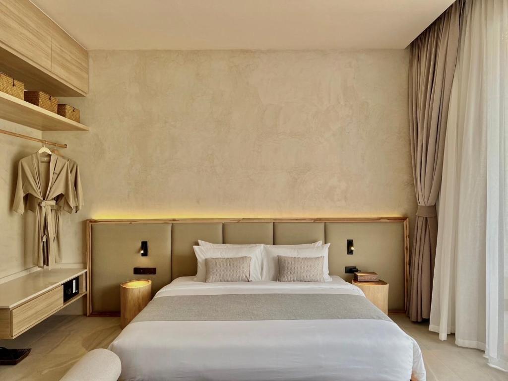 מיטה או מיטות בחדר ב-Eden Resort & Villas