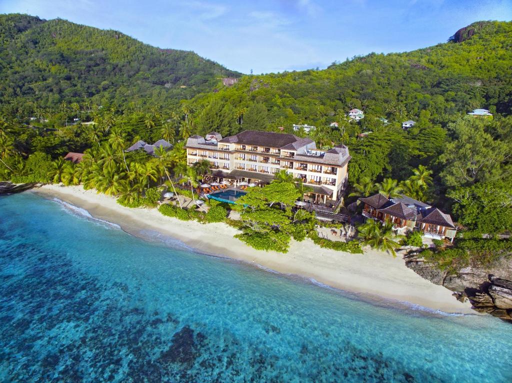 an aerial view of a resort on a beach at DoubleTree by Hilton Seychelles Allamanda Resort & Spa in Takamaka