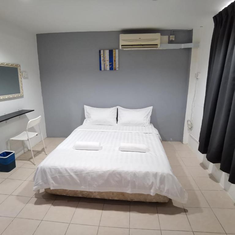 Postel nebo postele na pokoji v ubytování Hotel Seroja