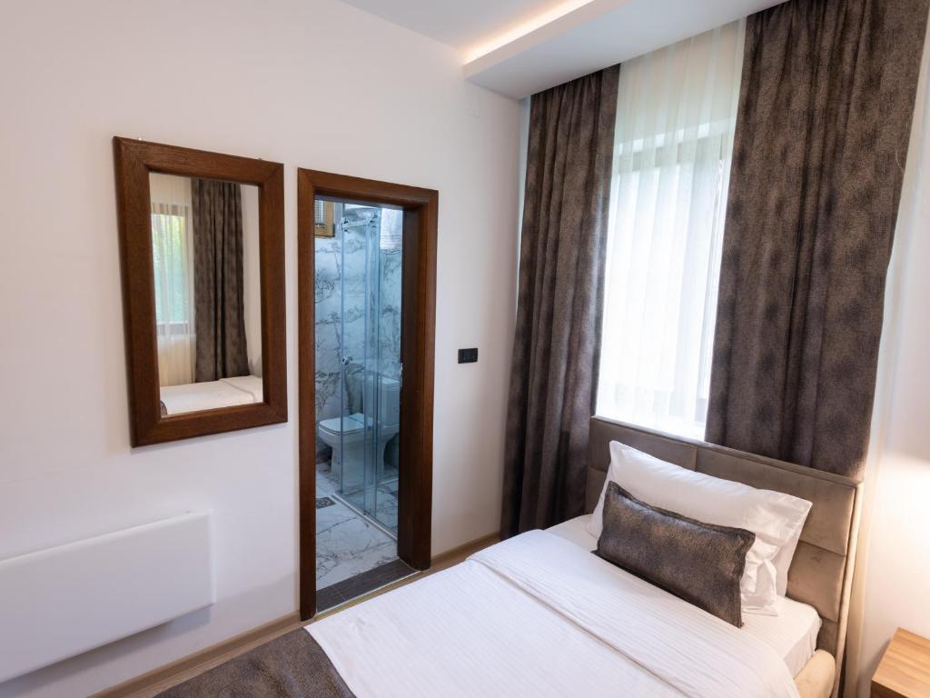 Postel nebo postele na pokoji v ubytování Hotel RAS Pazarište