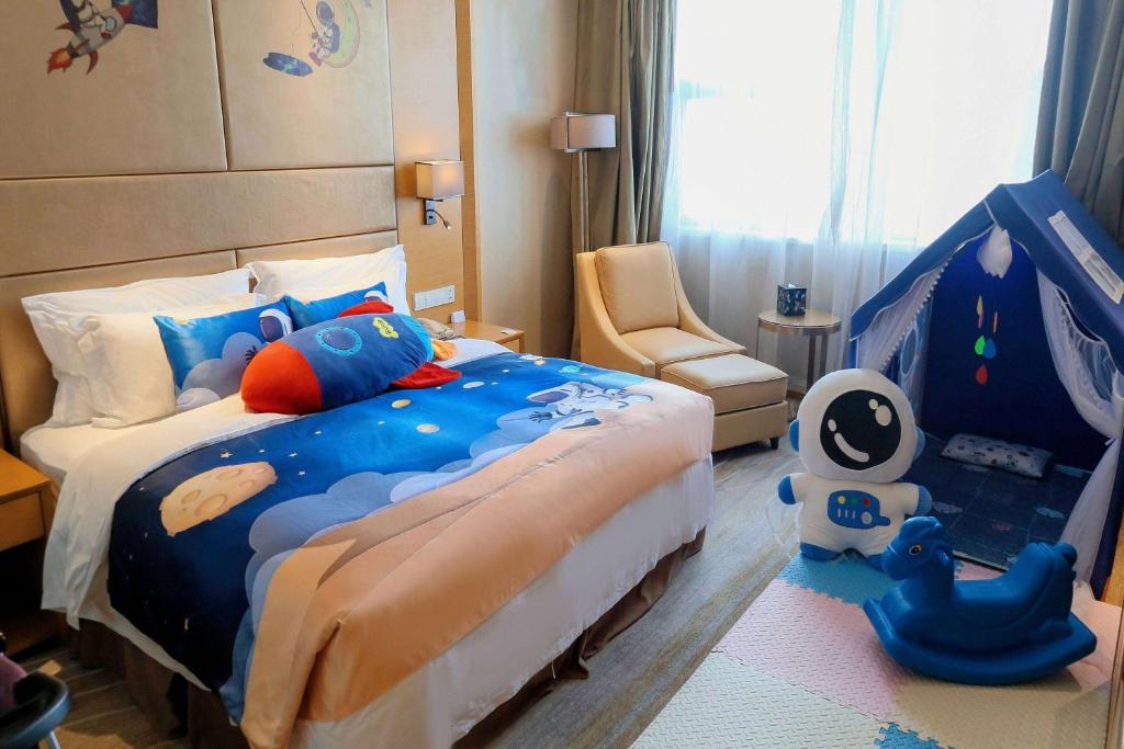 Postel nebo postele na pokoji v ubytování Wyndham Jingzhou