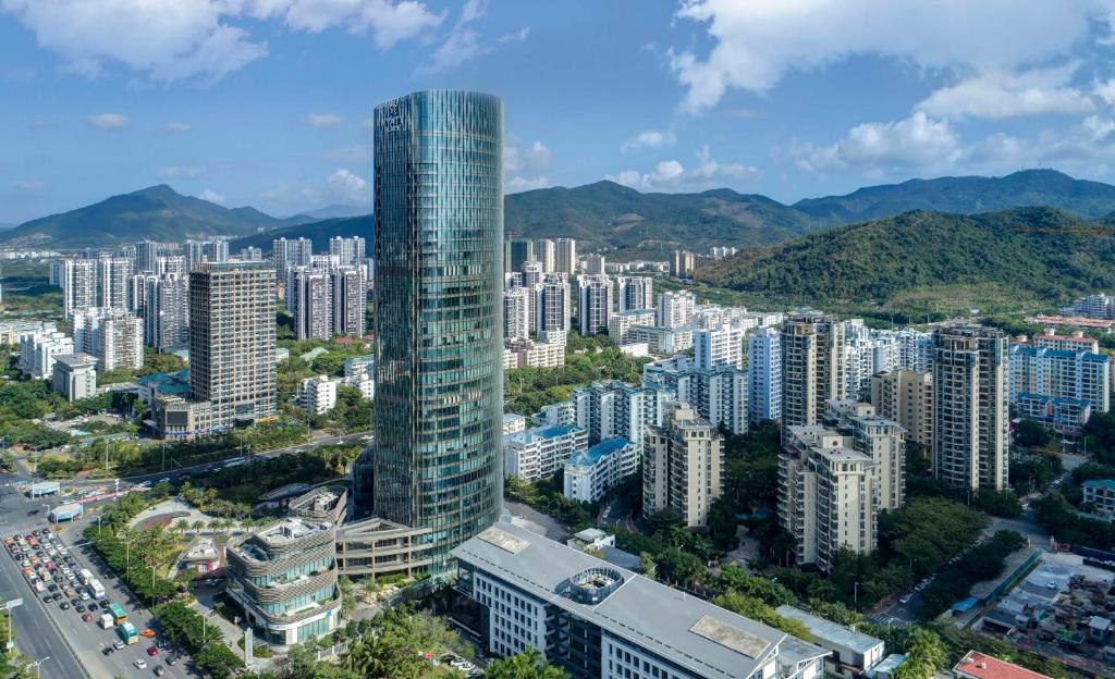 an aerial view of a city with tall buildings at Hyatt Place Sanya City Center in Sanya