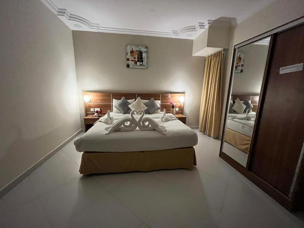 Postel nebo postele na pokoji v ubytování Muscat Hills Hotel