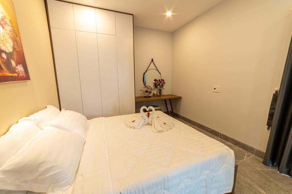 Postel nebo postele na pokoji v ubytování Sweet Home gần bãi sau