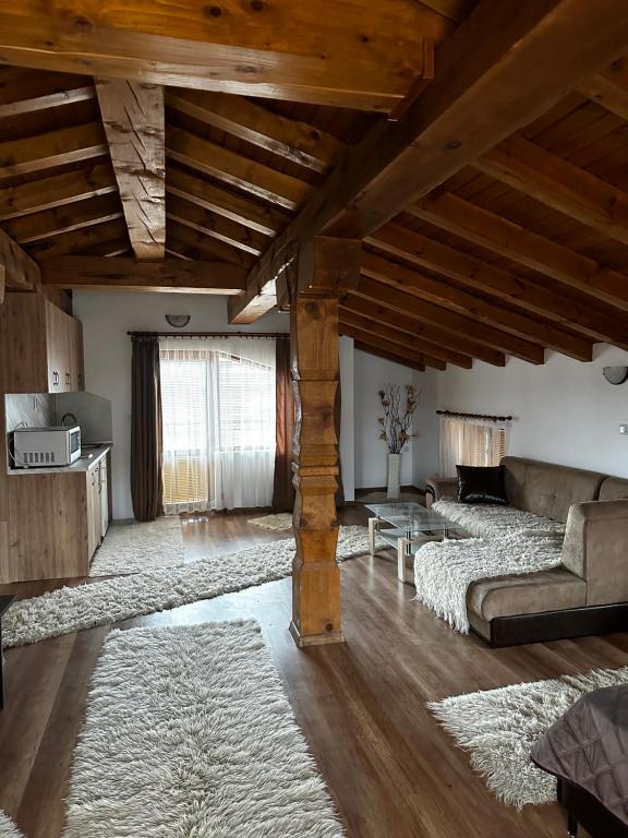 a living room with a couch and a table at Snow House in Bansko