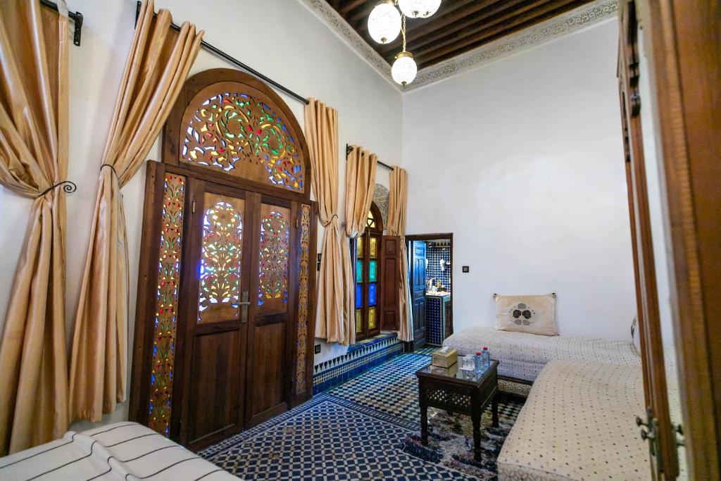A bed or beds in a room at Dar Borj
