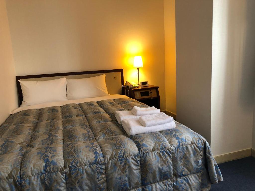 Postel nebo postele na pokoji v ubytování Hotel 28 Hiroshima