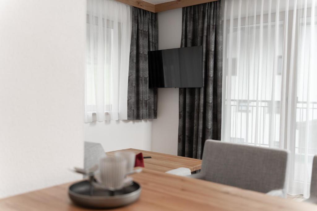 Televízia a/alebo spoločenská miestnosť v ubytovaní A CASA Turmalin