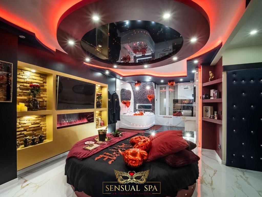 a bedroom with a bed with a skull on it at Sensual SPA- Love ROOM Jacuzzi Hammam Terrasse in Nancy