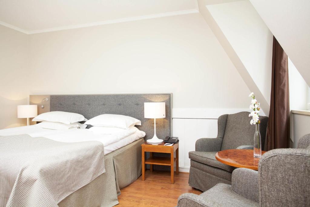 Postel nebo postele na pokoji v ubytování Hotel Bishops Arms Malmö