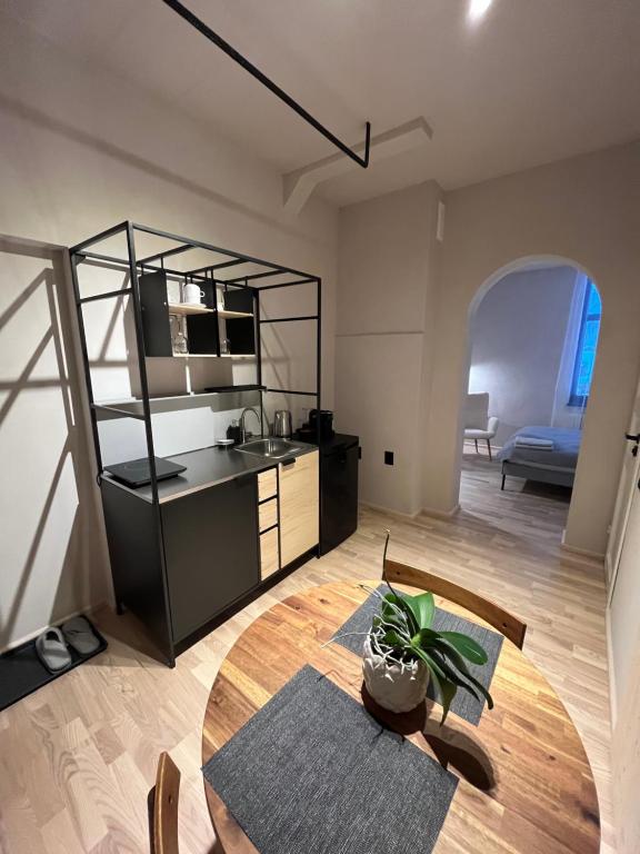 a kitchen and dining room with a table in a room at Garden House Apartments in Cēsis