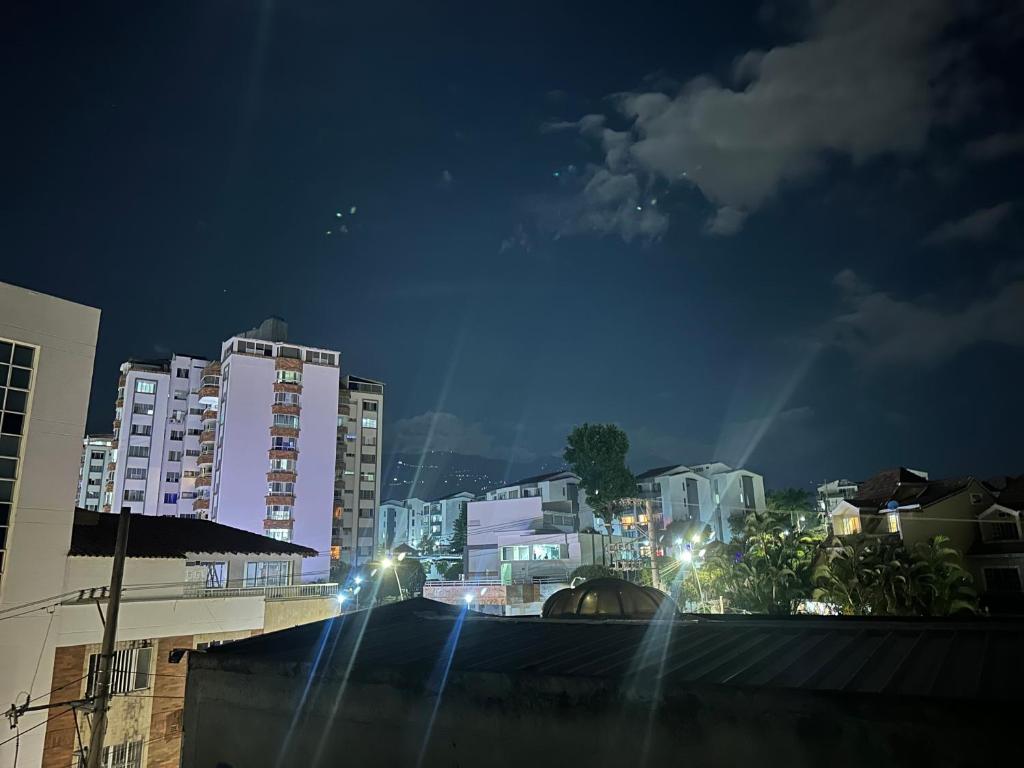 a city at night with buildings and street lights at apartamento completo en Cañaveral in Cañaveral