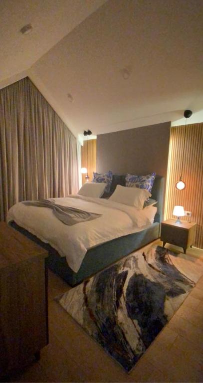 Кровать или кровати в номере Duplex in four seasons new gudauri near gondola