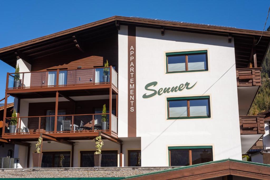 a building with a sign that reads server at Senner Appartements in Umhausen