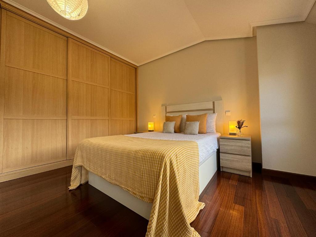 En eller flere senge i et værelse på Fantástico Dúplex Vista Bahia