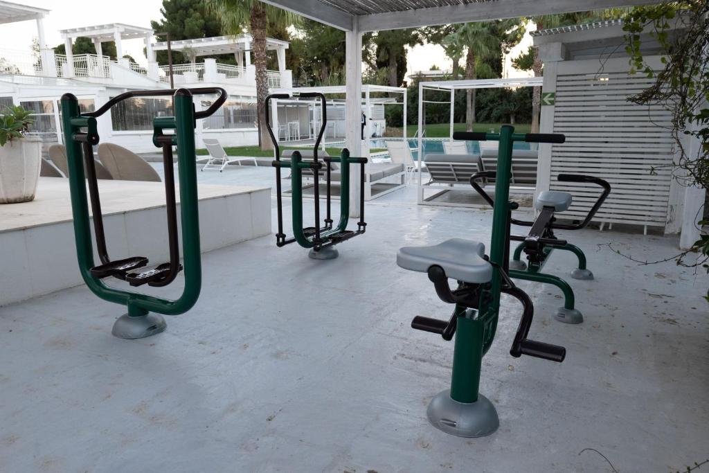 a row of exercise equipment on a patio at San Lorenzo Boutique Hotel & SPA in Polignano a Mare