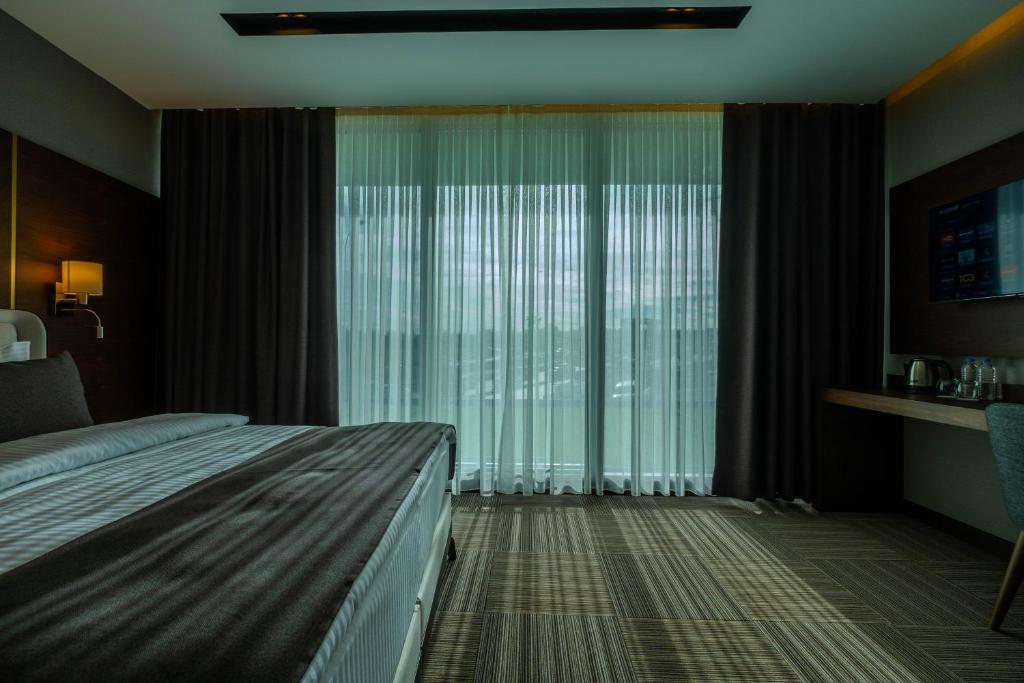 Postel nebo postele na pokoji v ubytování B'İSTANBUL HOTEL
