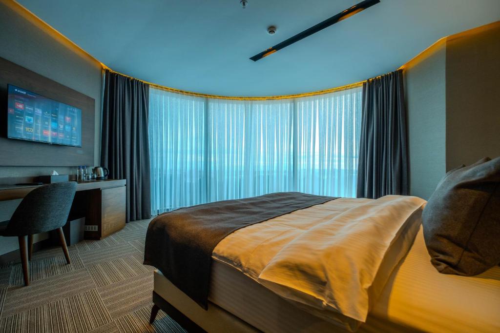 Postel nebo postele na pokoji v ubytování B'İSTANBUL HOTEL