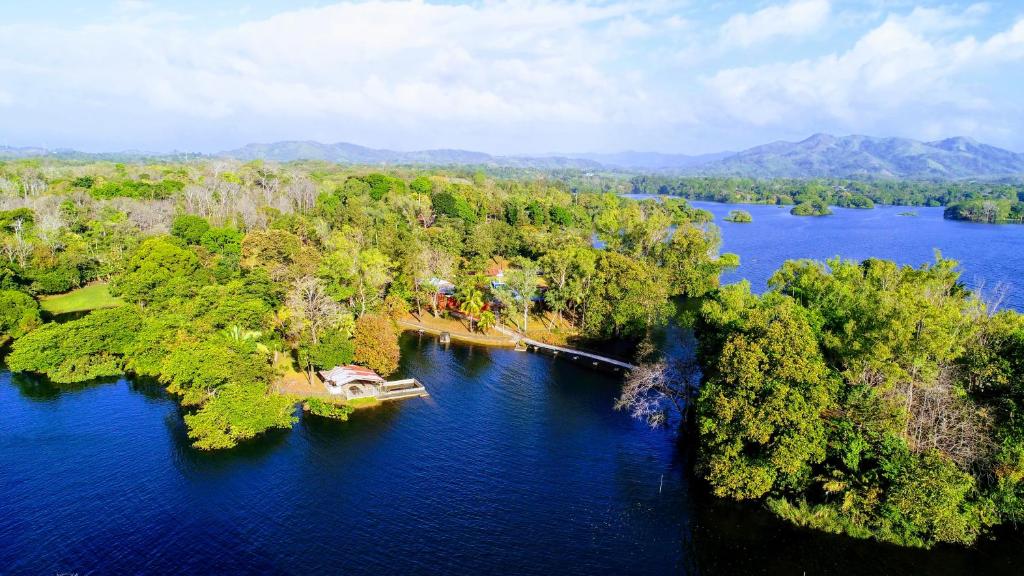 an island in the middle of a river with trees at Hacienda Alajuela in Colón