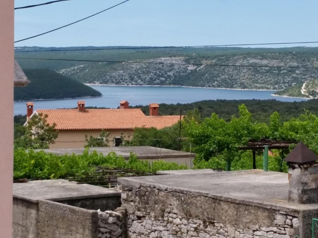 a view of a lake from a house at Holiday Home Casa Matilde in Koromačno