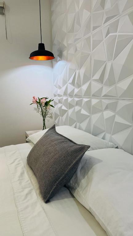 Postel nebo postele na pokoji v ubytování Kromatic Hostel