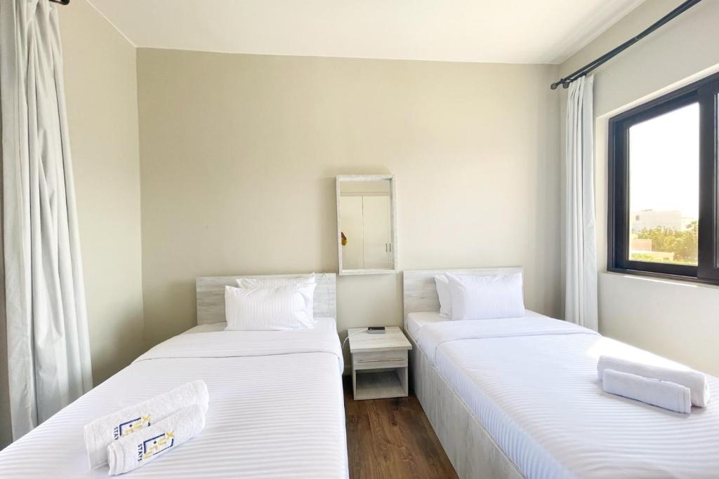 Postel nebo postele na pokoji v ubytování Poised & Pearly 3 BDR Villa Cyan El Gouna