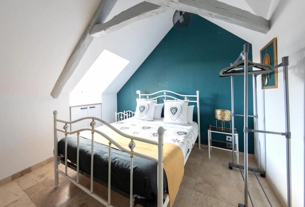 Säng eller sängar i ett rum på Le Relais de la Poste