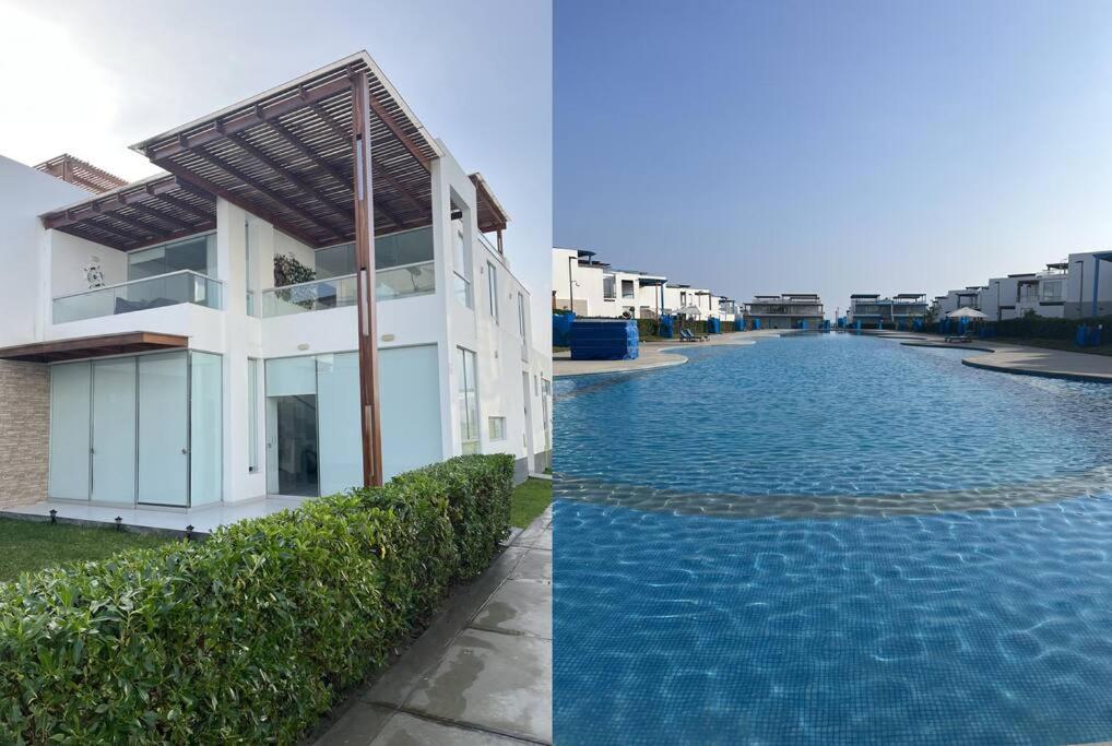 una casa y una piscina al lado de un edificio en Casa de Playa en Asia 15 personas por noche, en Asia