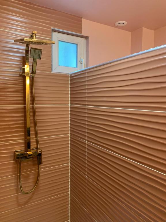 a shower in a wall with a window at The home Privacy in Marseille
