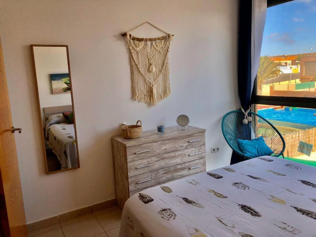 En eller flere senger på et rom på Villa Costa Antigua Piscina