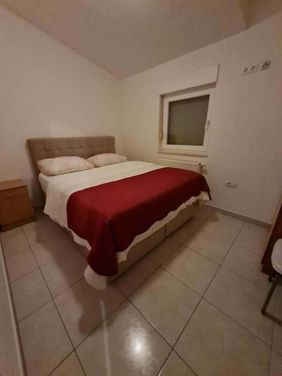 Posteľ alebo postele v izbe v ubytovaní Apartments and rooms Niki 2